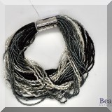 J161. Multi strand seed beaded bracelet with silver clasp. - $28 